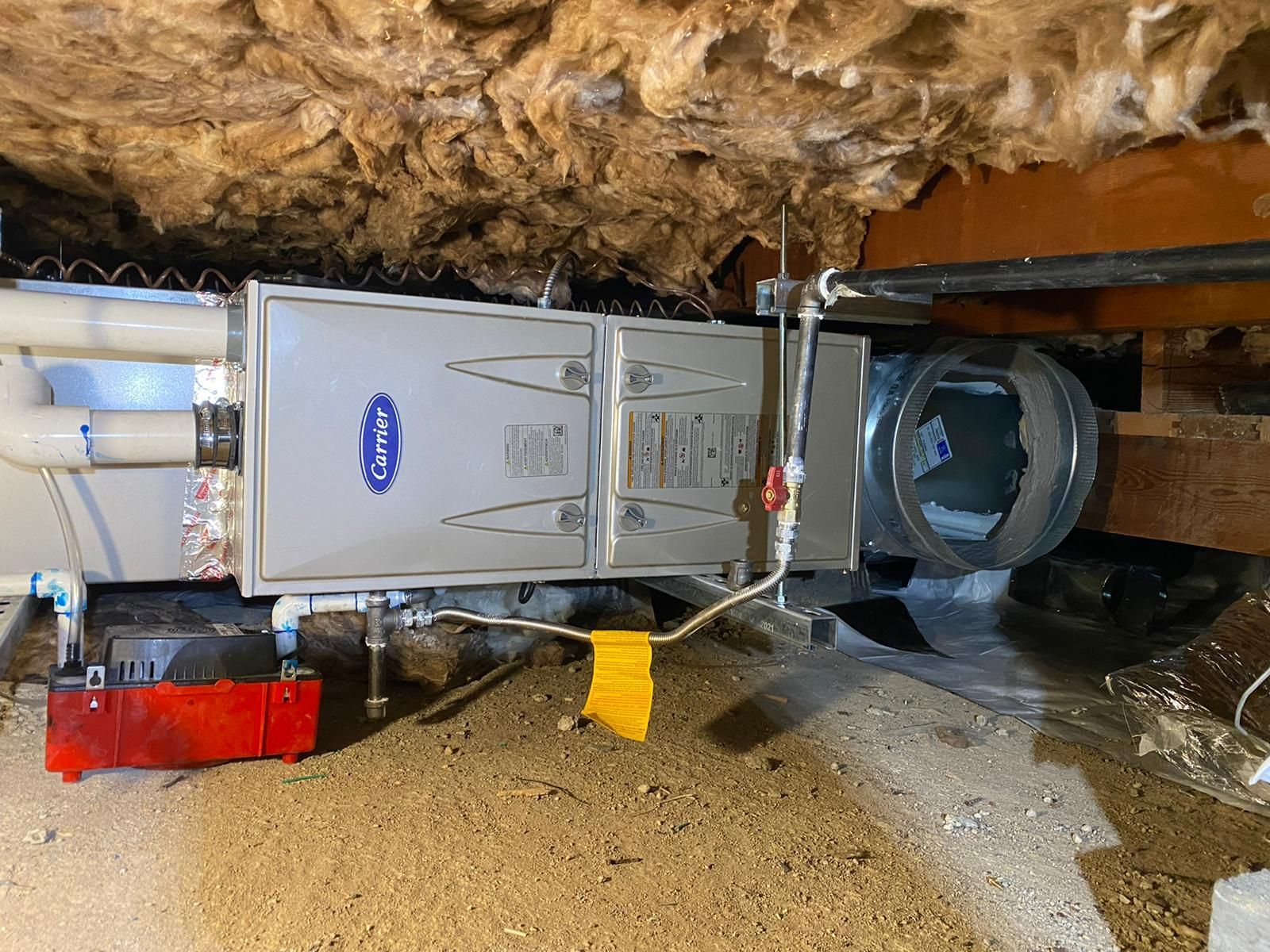 A picture of a furnace in a basement.