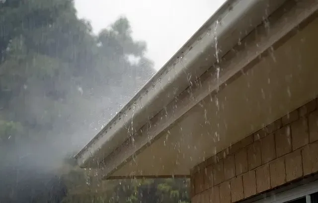 Rain Falling From a White Gutter — Blue Sky Roofing NSW In Murwillumbah, NSW