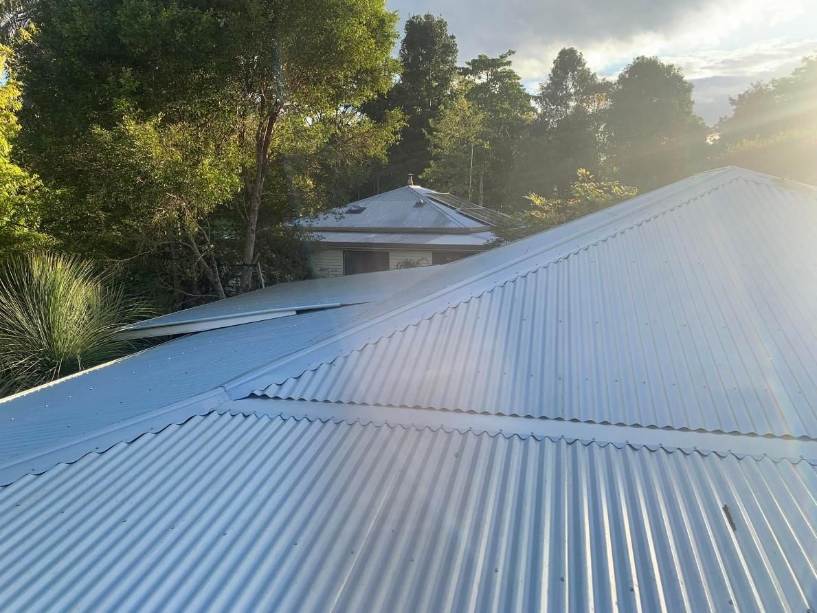 a Light Blue Corrugated Metal Roof on a Building — Blue Sky Roofing NSW In Mullumbimby, NSW