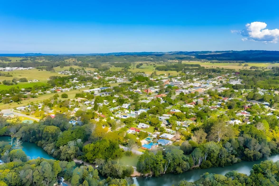Aerial View of a Small Town Surrounded by Green Fields — Blue Sky Roofing NSW In Mullumbimby, NSW