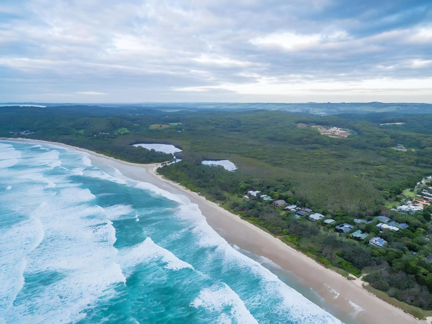 Aerial View of a Coastline — Blue Sky Roofing NSW In Ocean Shores, NSW