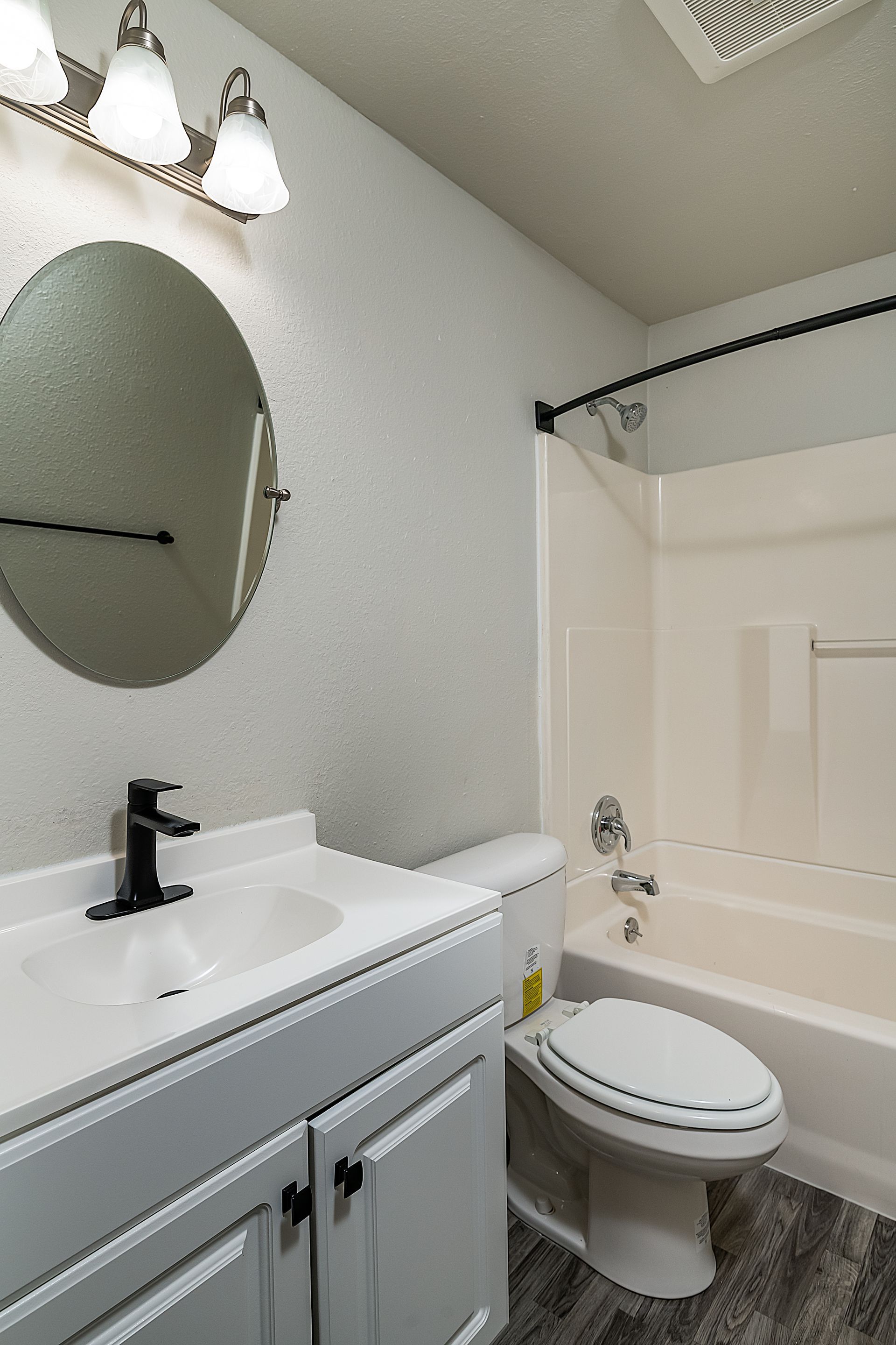 Photo showing the bathroom with a combination of a shower/tub