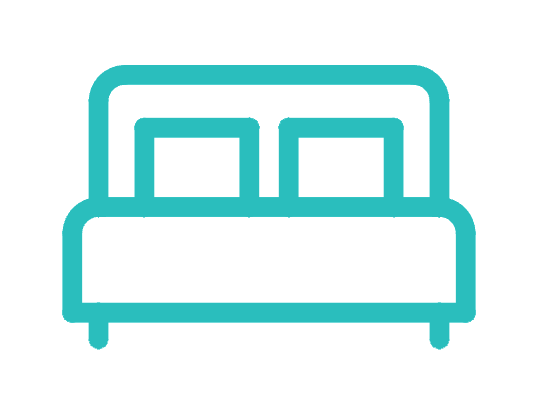 A blue icon of a bed with two pillows on a white background.