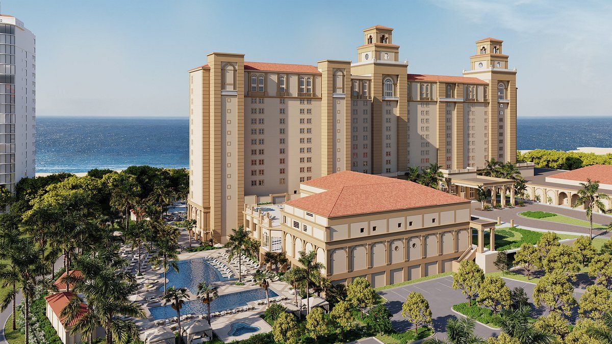 An artist 's impression of a large building next to the ocean.