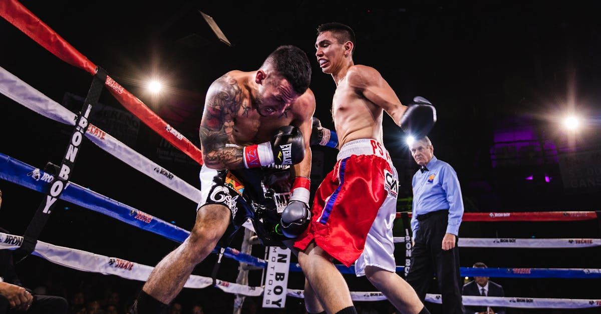 Two men are boxing in a boxing ring.