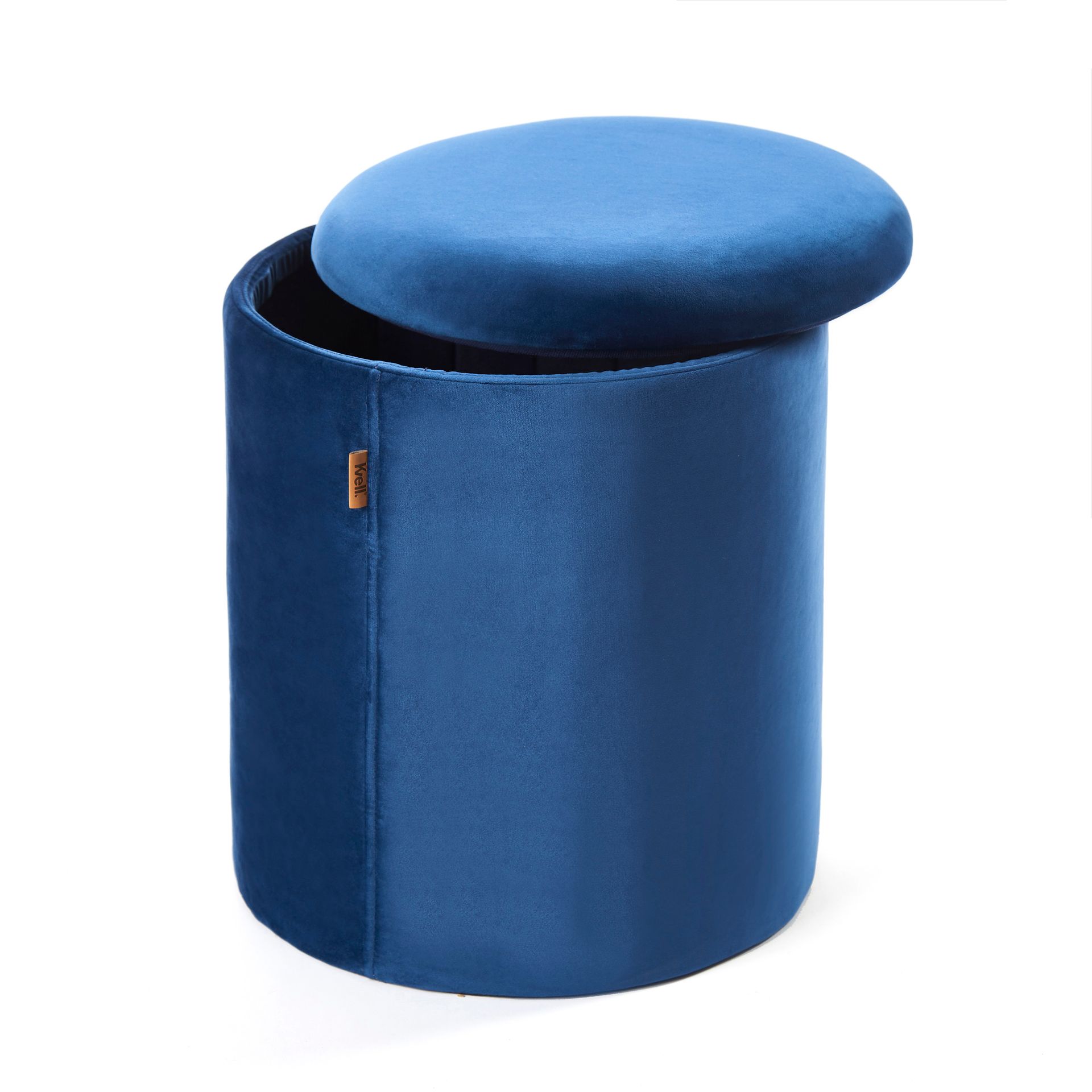 A blue velvet ottoman with the lid open