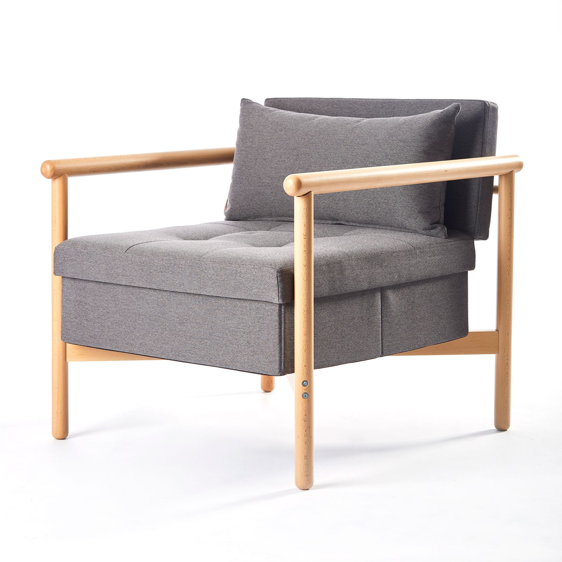 A grey chair with wooden armrests and a pillow on a white background.