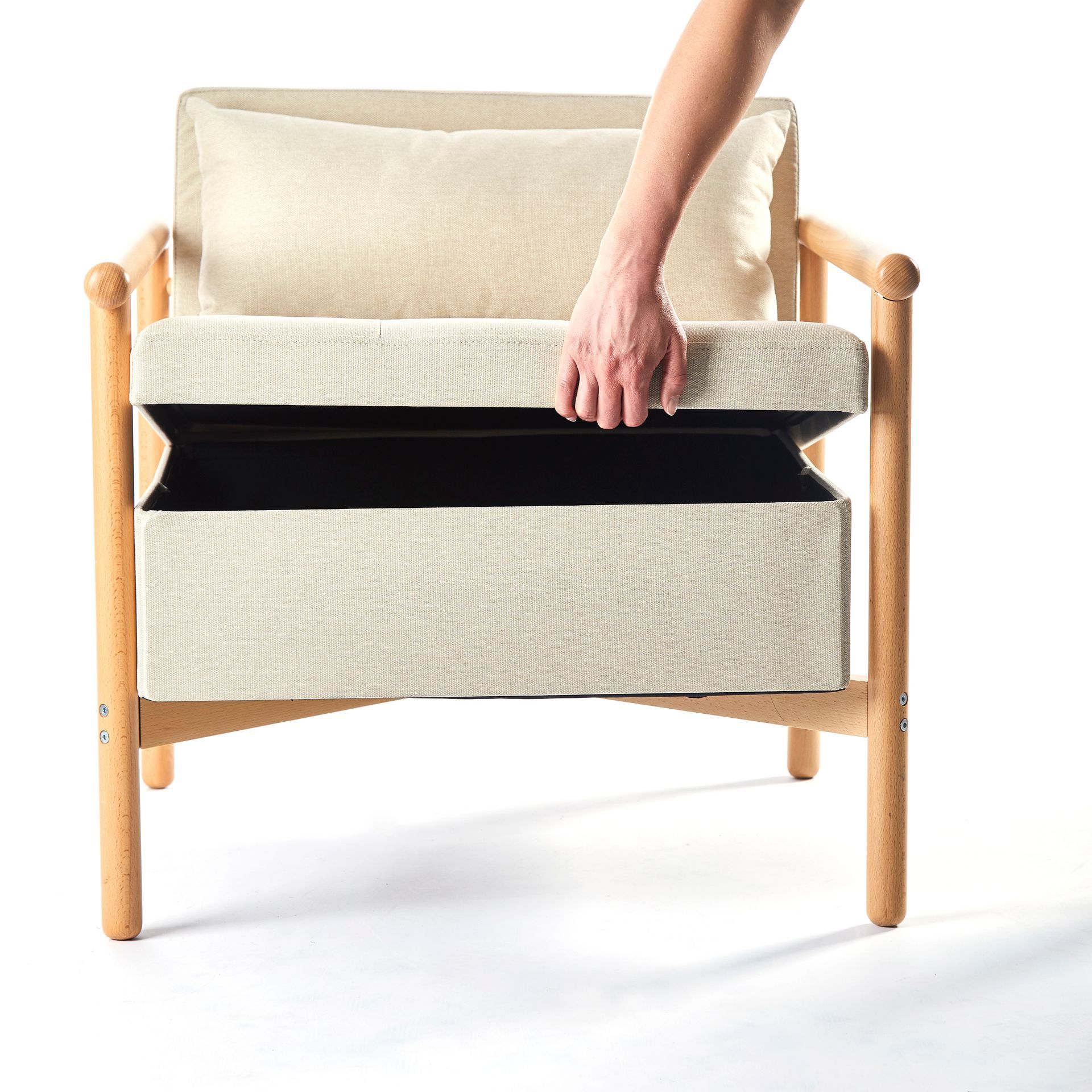 A person is reaching into the back of a chair