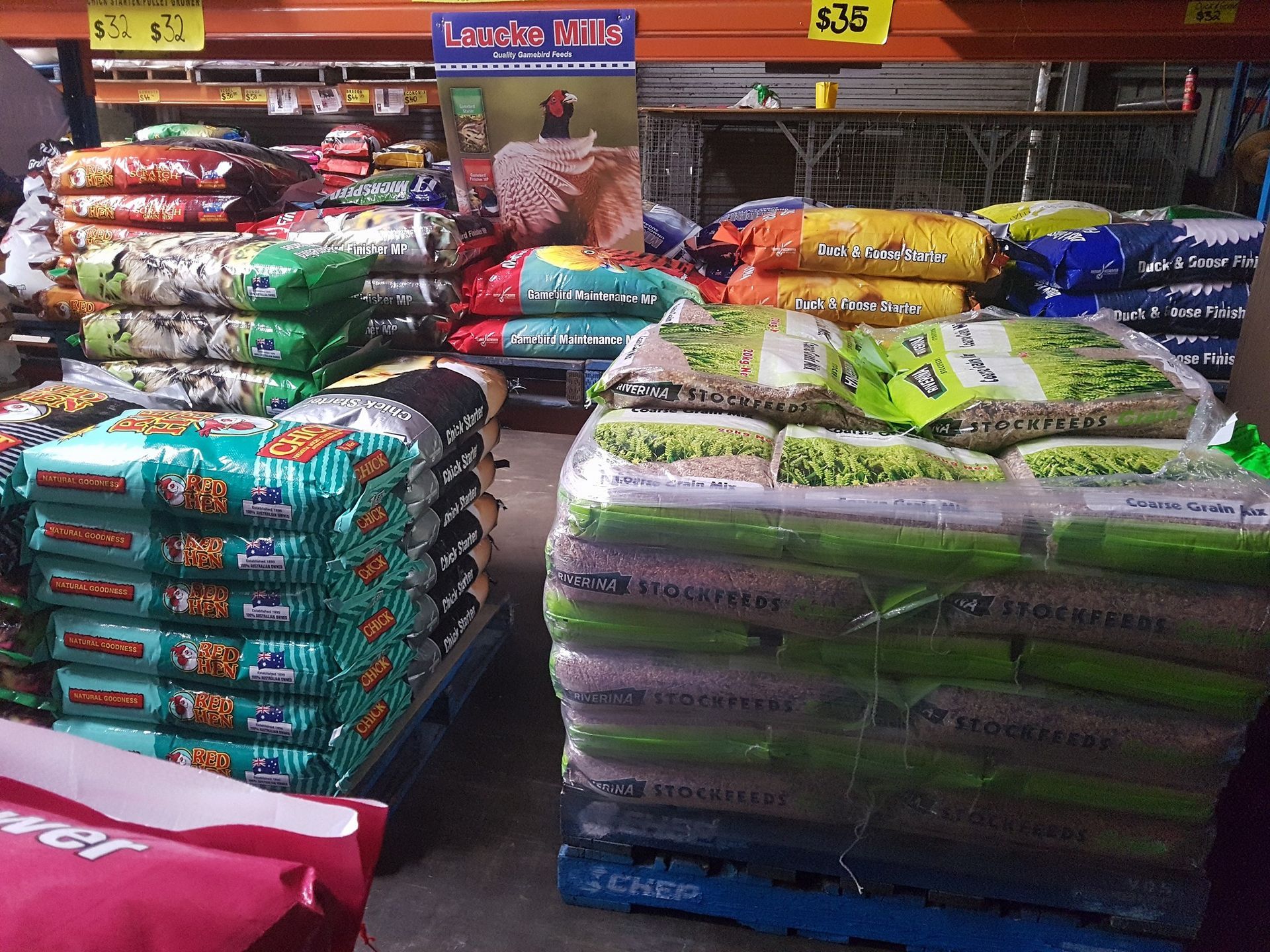 Bags of Animal Feed Stacked on Pallets in a Store — NQ Stockfeeds & Farm Supplies In Yorkeys Knob, QLD