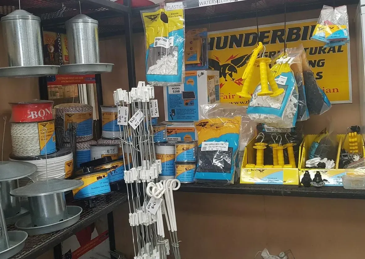 Shelves Stocked With Bird Feeders and Birdseed in a Store — NQ Stockfeeds & Farm Supplies In Port Douglas, QLD