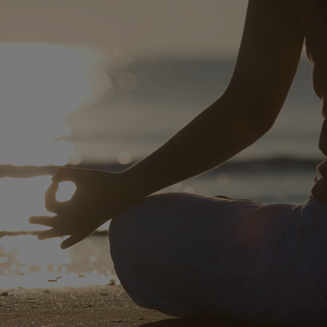 meditating woman during sunset