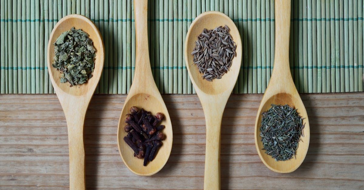 spoons holding various herbs