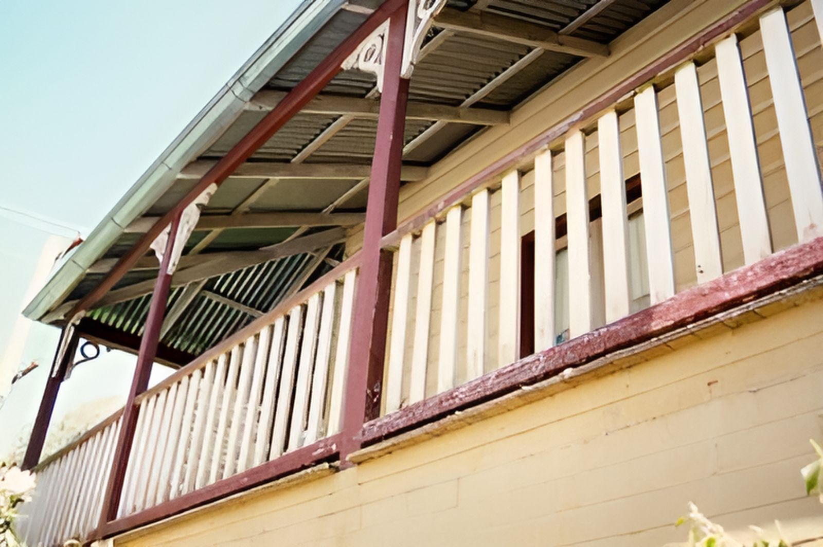 A House With A Balcony And A Red And White Railing — Yves De Wilde Quality Painting Services In Lismore, NSW