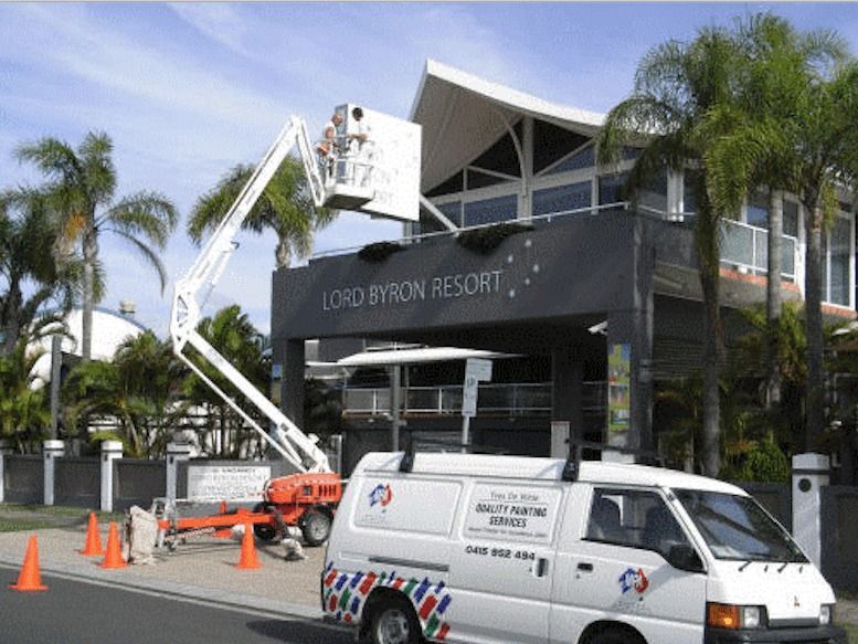 A White Van Is Parked In Front Of A Building That Says Lord Byron Resort — Yves De Wilde Quality Painting Services In Lismore, NSW