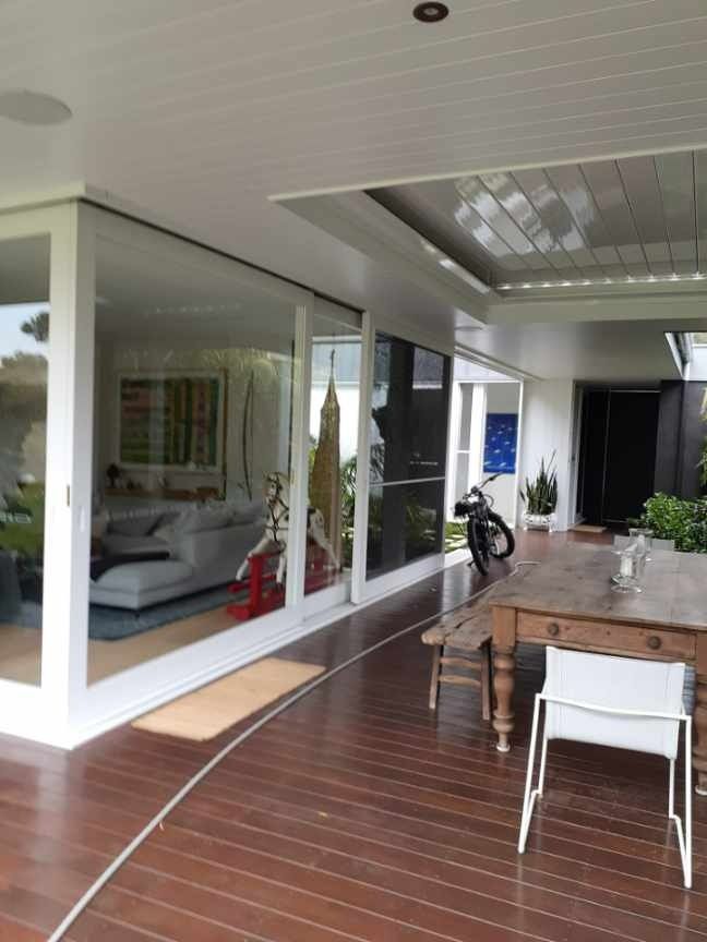 A Patio With A Table And Chairs In Front Of A Living Room — Yves De Wilde Quality Painting Services In Lismore, NSW