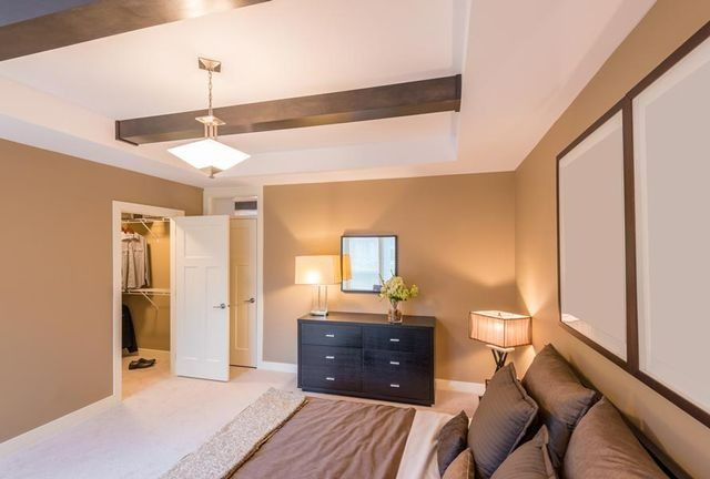 A Bedroom With A Bed, Dresser, Lamp And Mirror — Yves De Wilde Quality Painting Services In Lismore, NSW