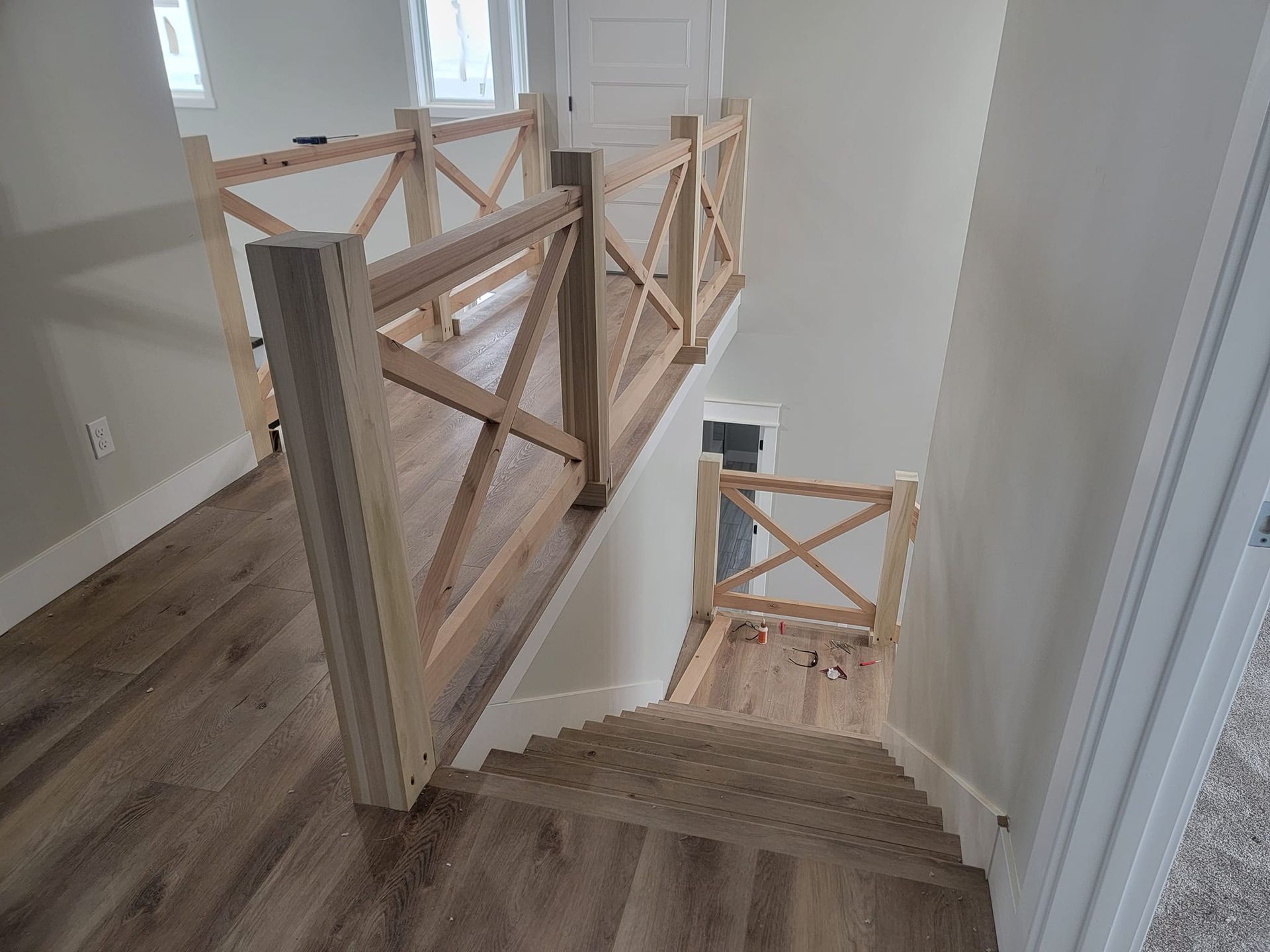 The stairs are made of wood and have a wooden railing.