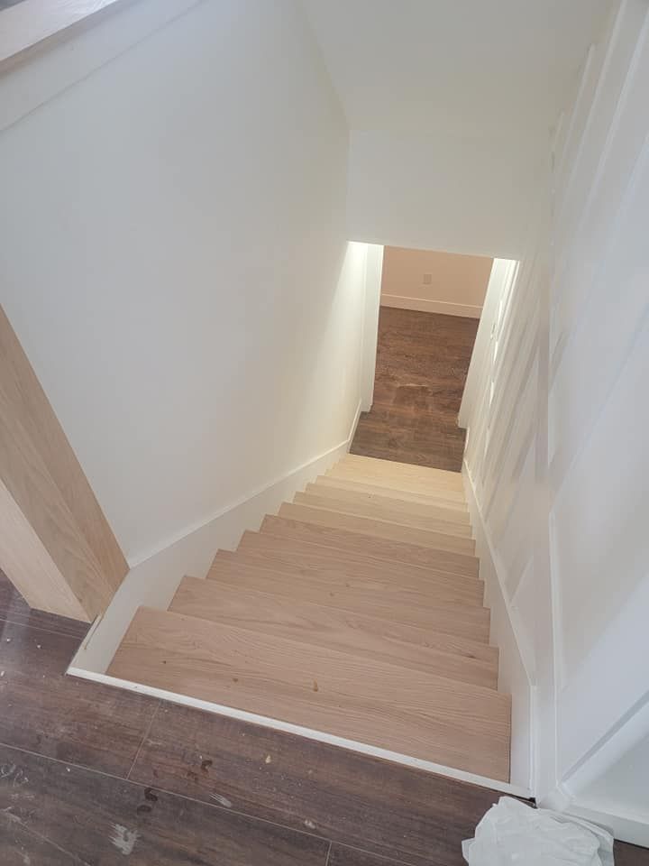 A wooden staircase leading up to the second floor of a house.