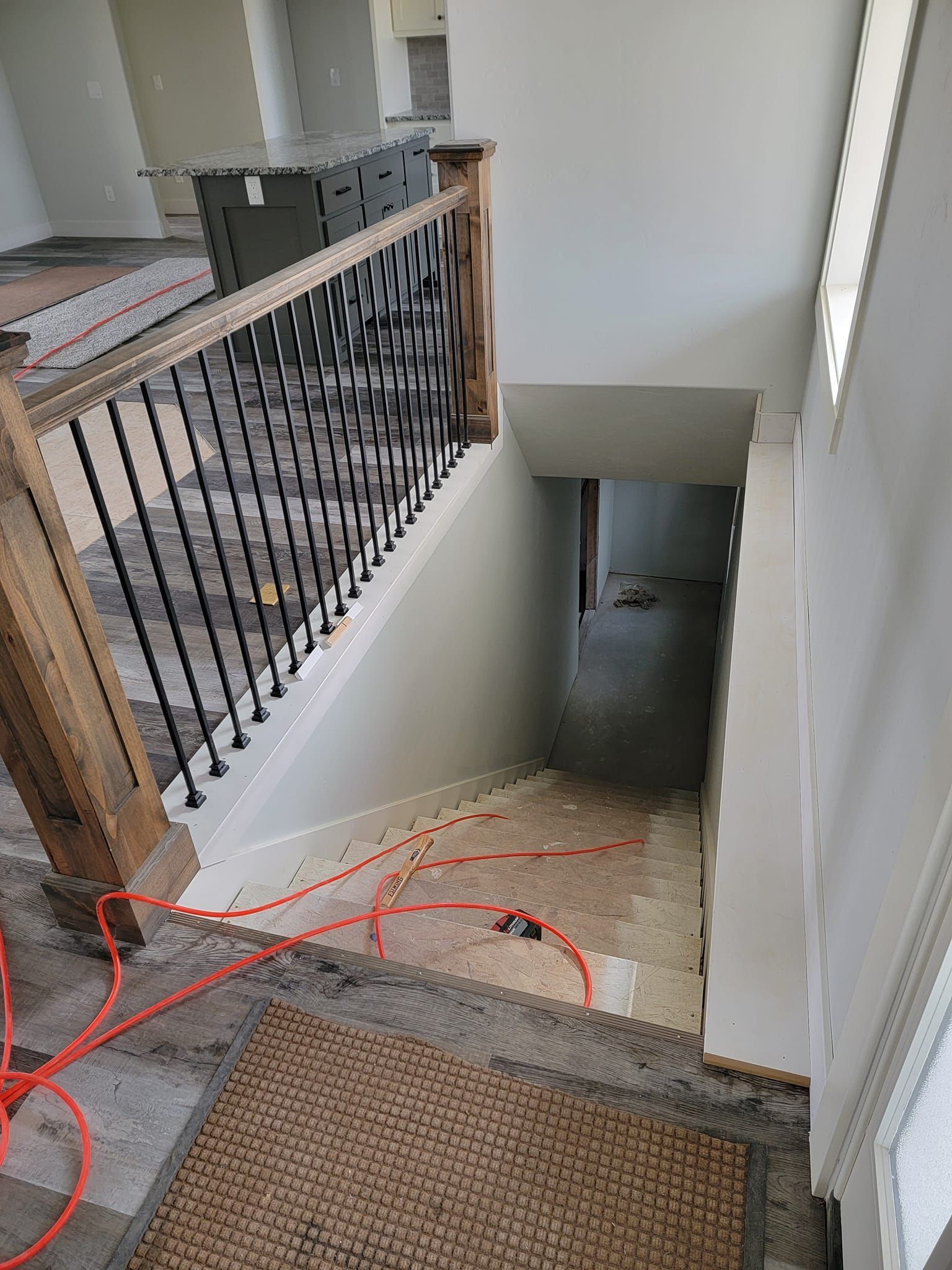 A picture of a staircase in a house under construction.
