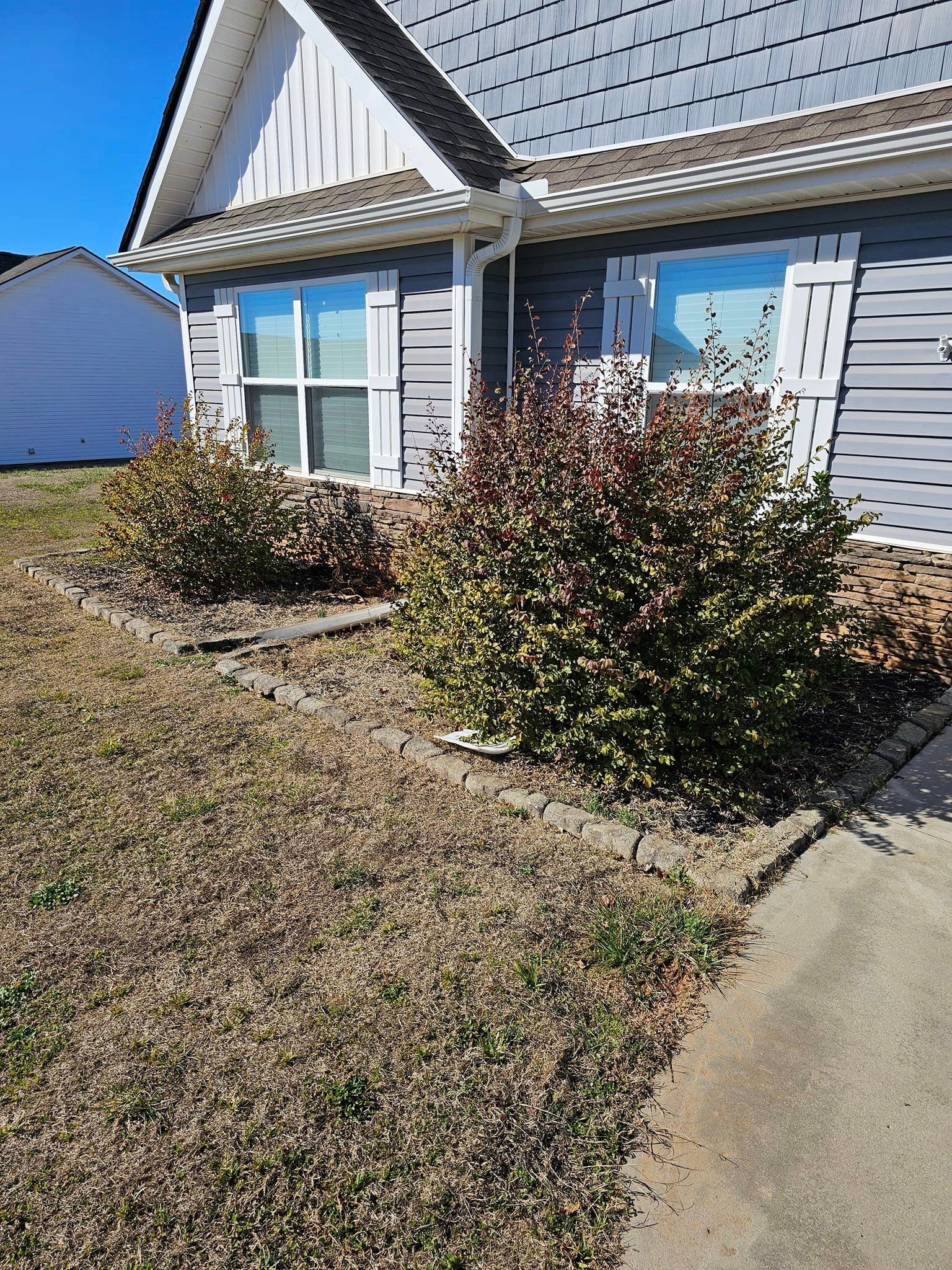 A house with a lot of bushes in front of it landrum 