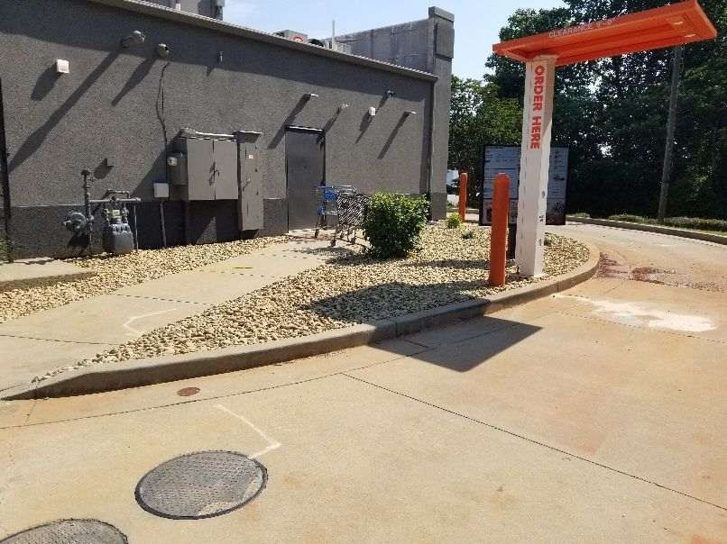 A drive thru with a sign that says order here