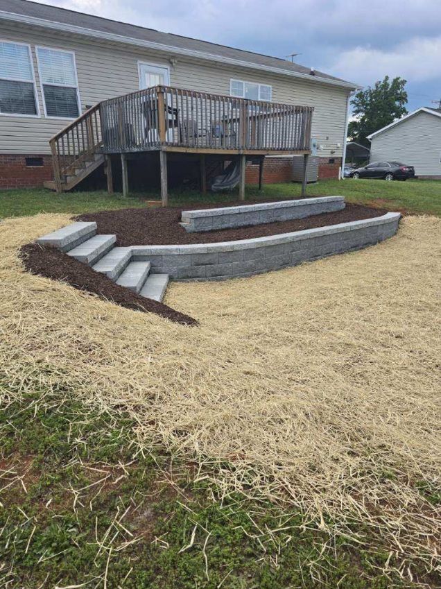 A house with a deck and stairs in front of it chesnee