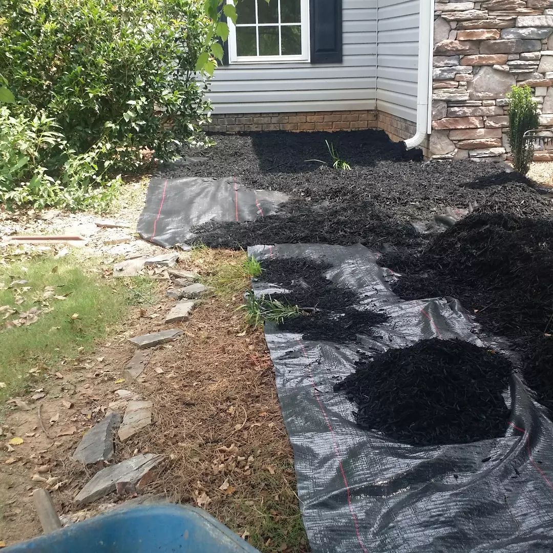 A pile of dirt is sitting in front of a house. spartanburg 