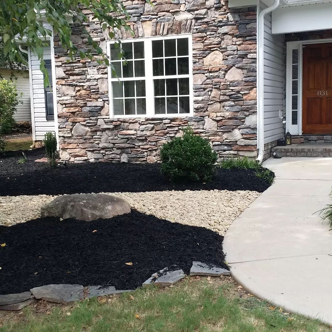 The front of a house with a stone facade boiling springs