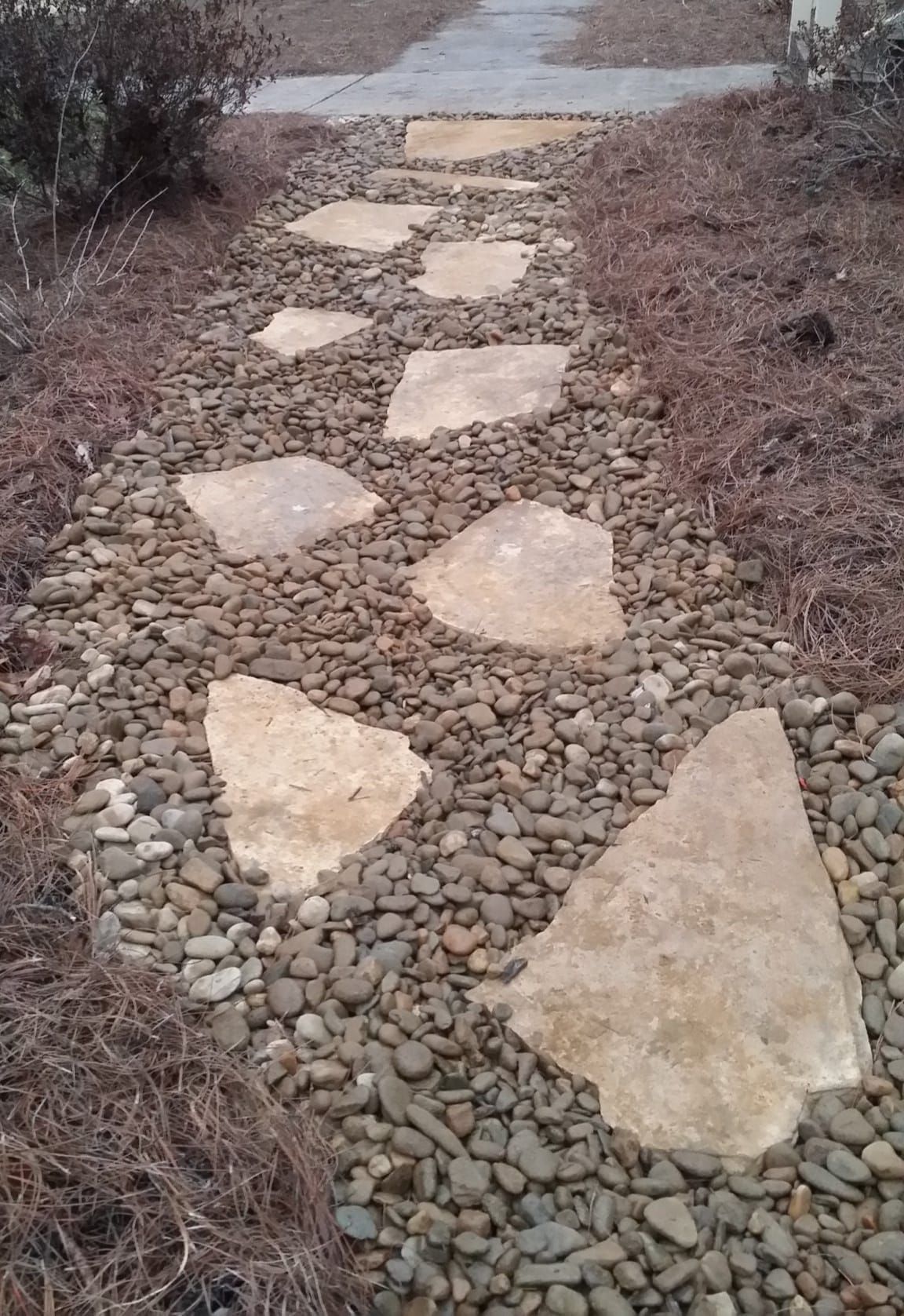 A stone walkway going through a field of rocks