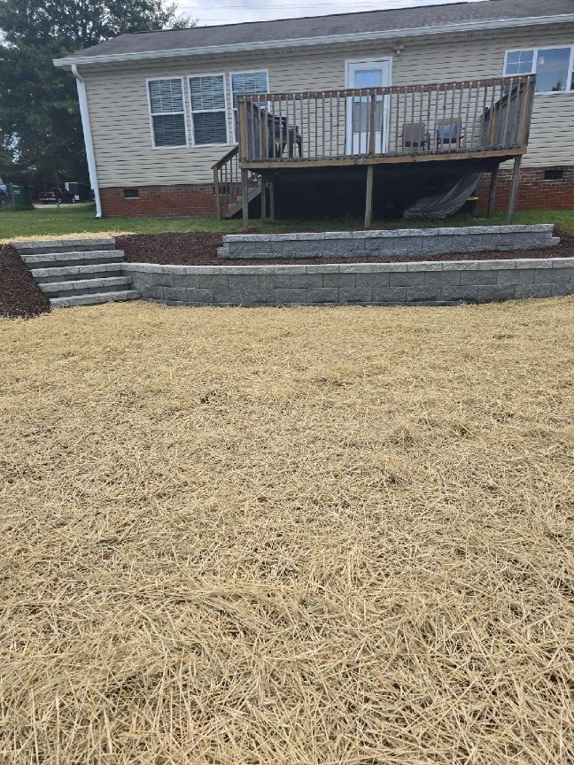 A house with a deck and stairs in front of it 