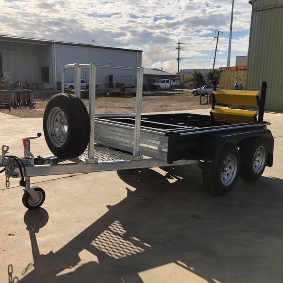 A Trailer With a Tire on the Back is Parked in a Parking Lot — SNS Custom Fabrication in Bundaberg East, QLD