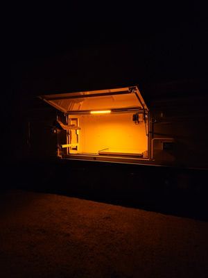 A Dark Room With a Yellow Light Coming Out of the Door — SNS Custom Fabrication in Bundaberg East, QLD
