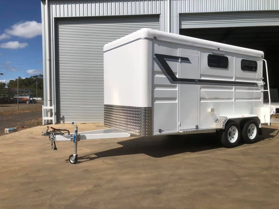 A White Horse Trailer is Parked in Front of a Building — SNS Custom Fabrication in Gracemere, QLD
