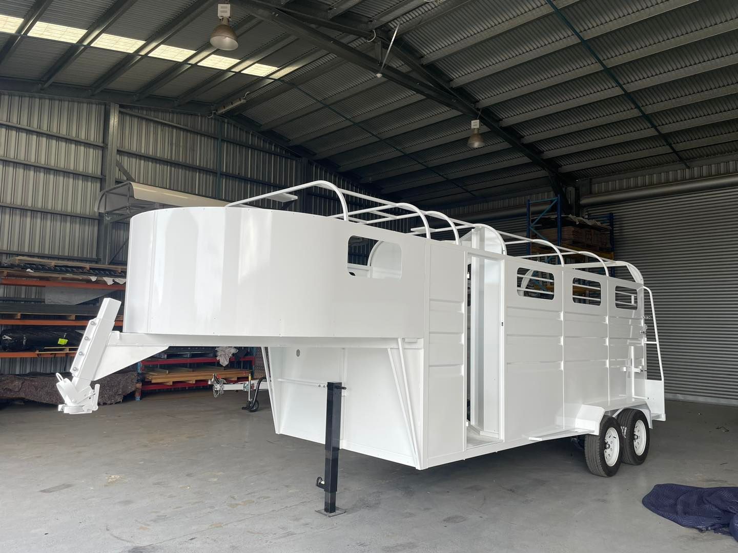 A White Horse Trailer is Parked in a Warehouse — SNS Custom Fabrication in Bundaberg East, QLD