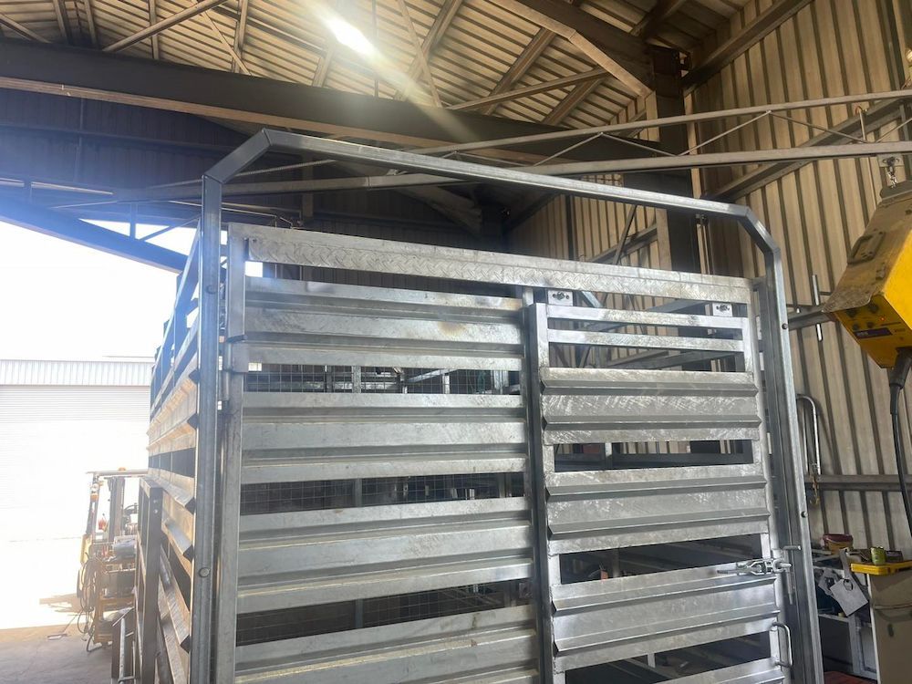 A Metal Fence is Sitting Inside of a Building — SNS Custom Fabrication in Gladstone, QLD