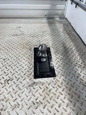 A Close Up of a Hitch on a Diamond Plated Floor — SNS Custom Fabrication in Bundaberg East, QLD