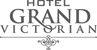 Logo for Hotel Grand Victorian featuring dark grey serif text with a decorative flourish below.