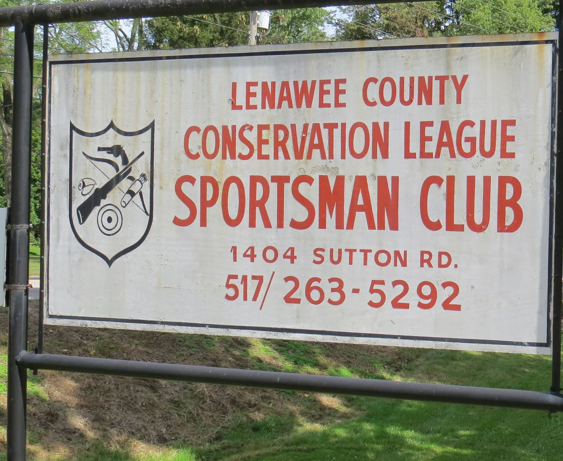 A sign for lenawee county conservation league sportsman club