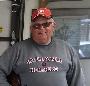 A man wearing a grey indiana hoosier shirt