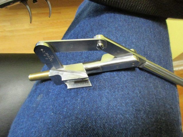 A metal object is sitting on a person 's lap