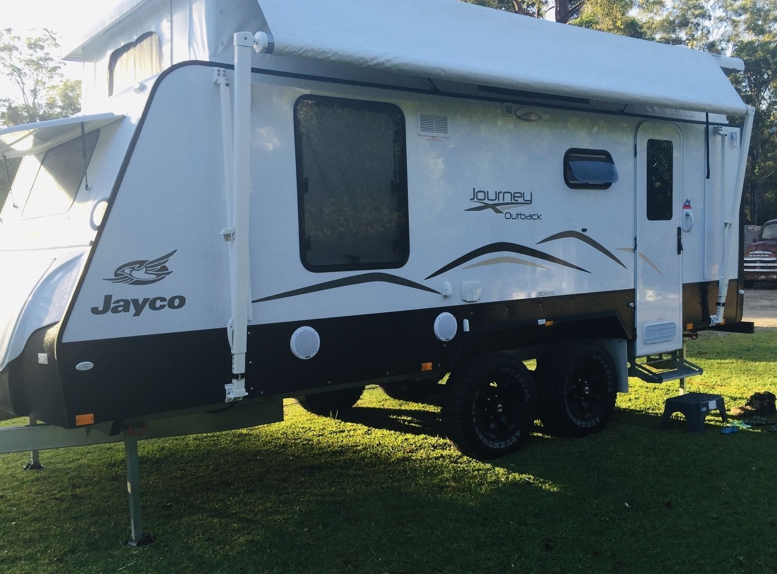 A White Jayco Trailer Is Parked In The Grass – Kempsey, NSW - Ezy Group Services