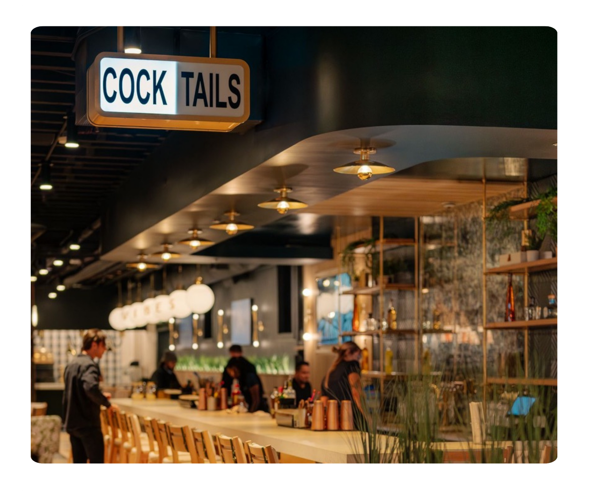 Prima Dopo bar with cocktail sign and white line border around image