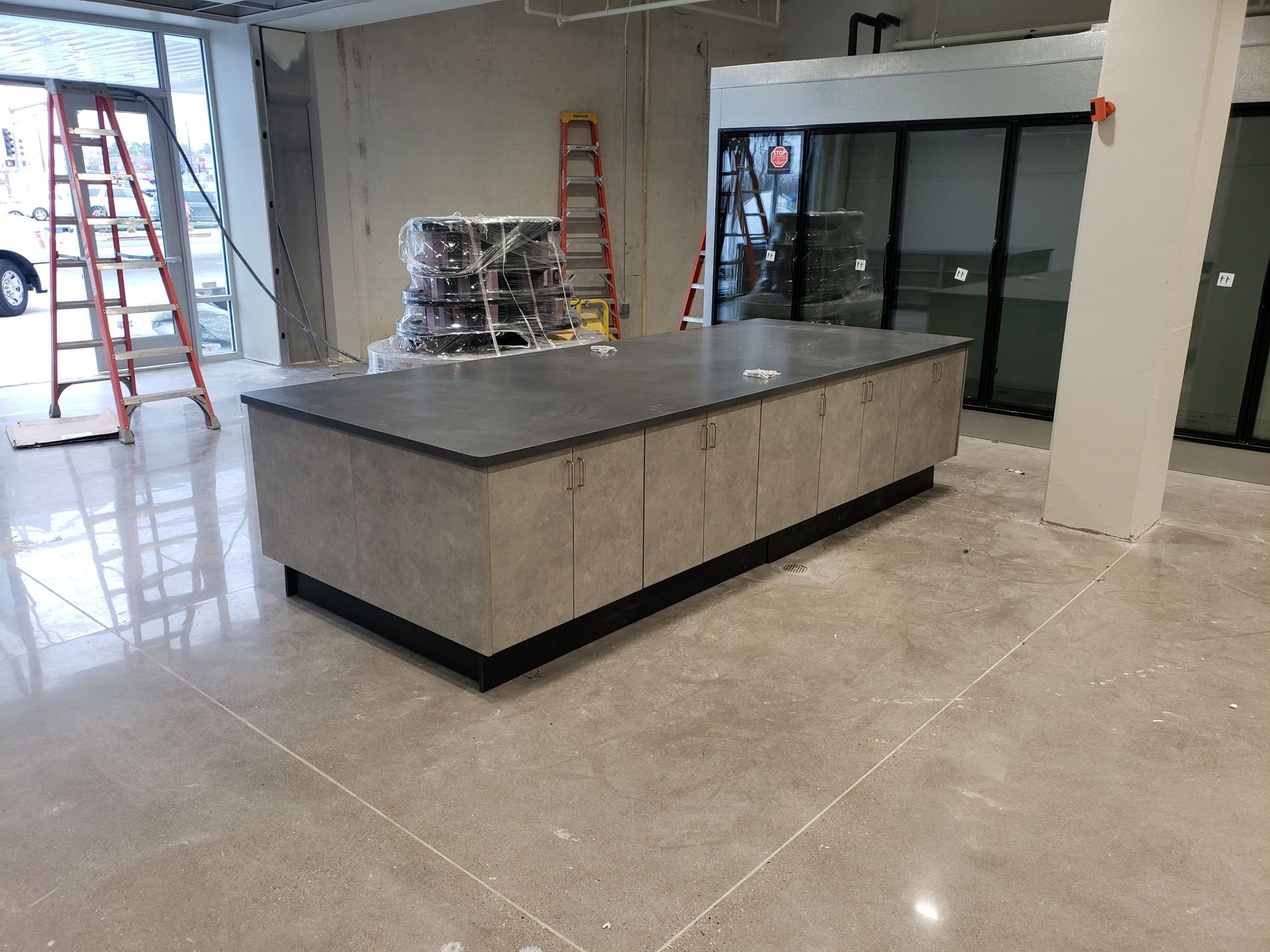 A salad bar with a sign that says olives for $ 2.50