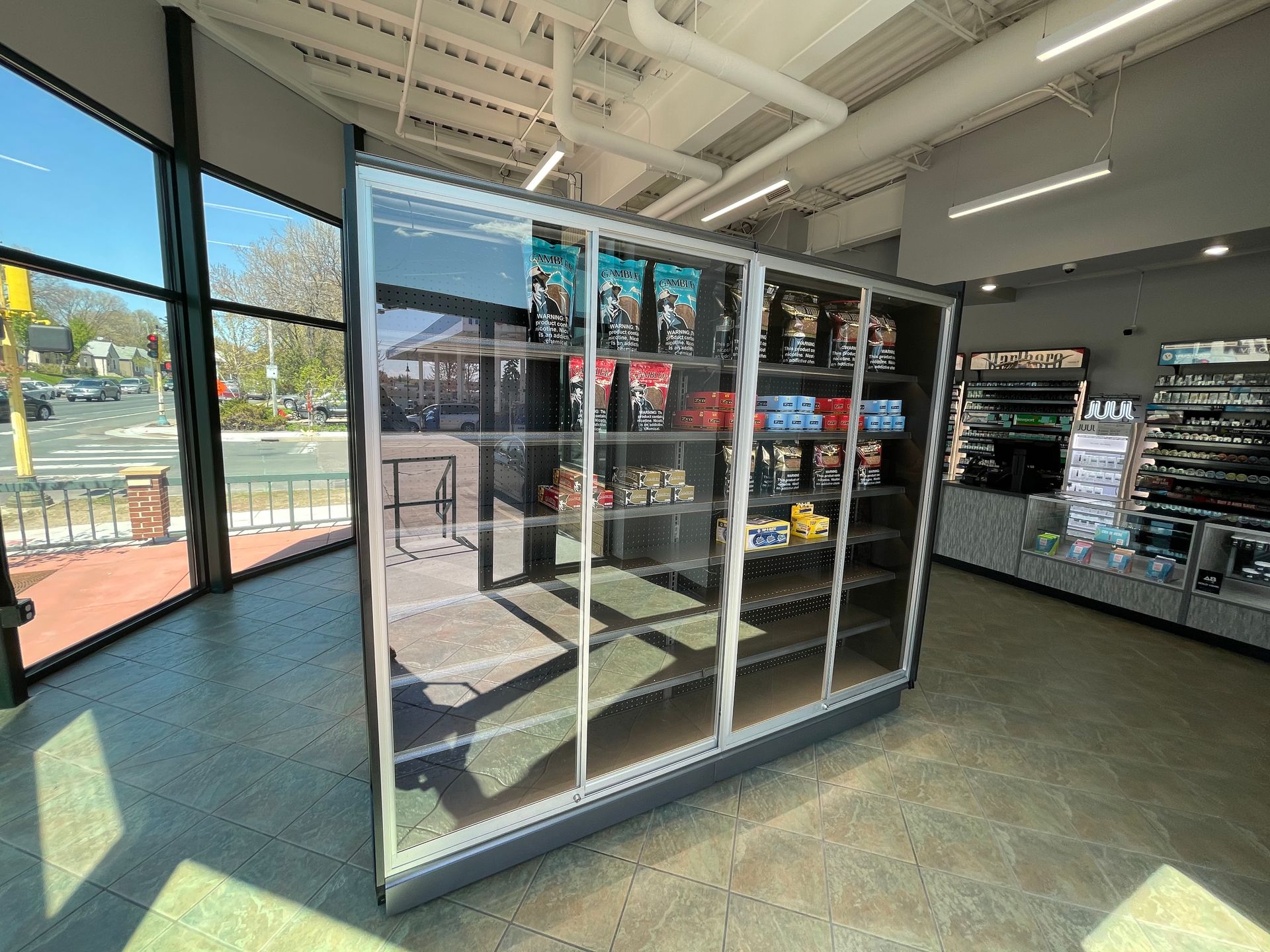 A large refrigerator filled with lots of items in a store.