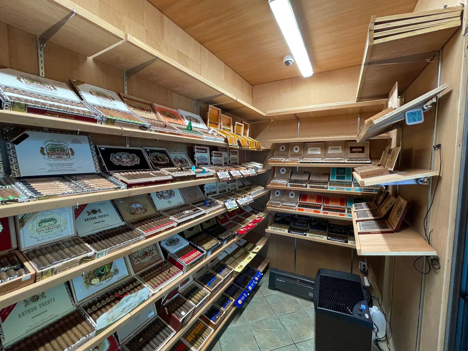 A room filled with shelves filled with lots of cigars.