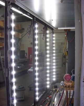 A room with a lot of lights hanging from the ceiling