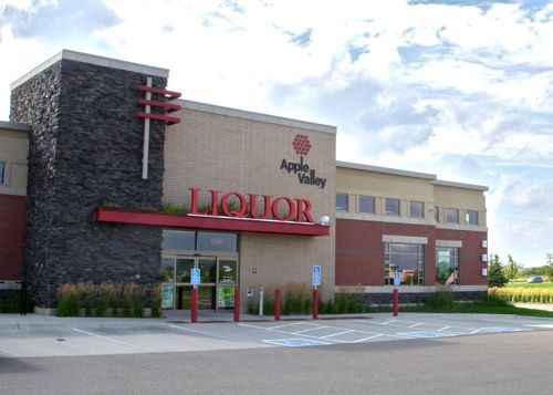 An apple valley liquor store with a handicapped parking spot in front of it