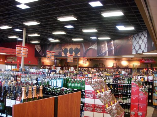 A liquor store filled with lots of bottles of wine