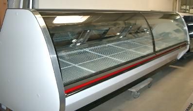 A large glass display case is sitting in a room.