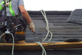 Worker Fixing Roof — South Lake, TX — Cunningham Contractors